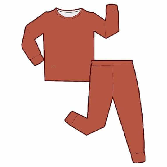 Wren Ivy Co. orange bamboo two-piece pajama set displayed in flat lay, showcasing the comfortable design and organic material for babies.